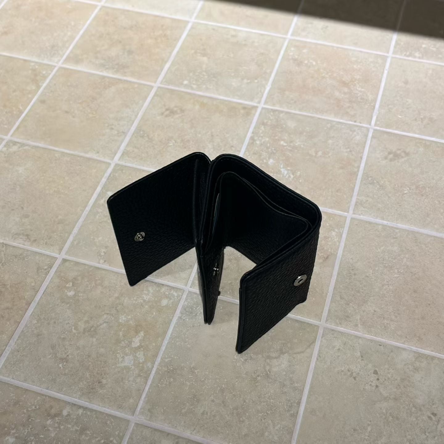 Tri-fold leather wallet