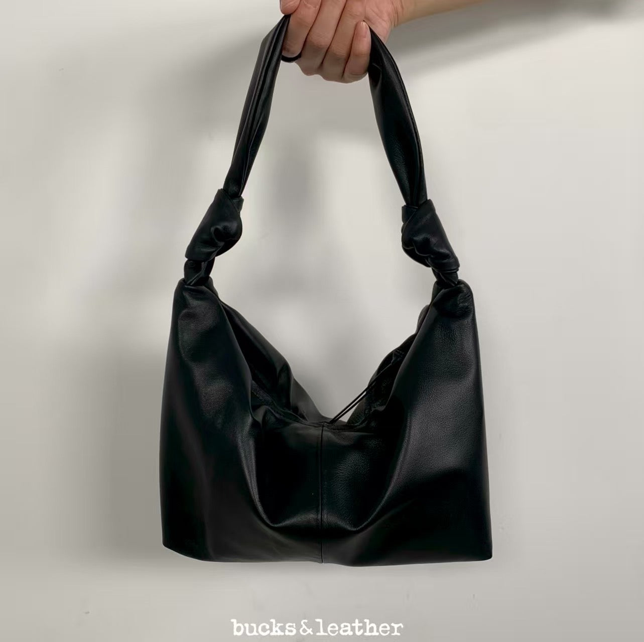 Knotted handle bag